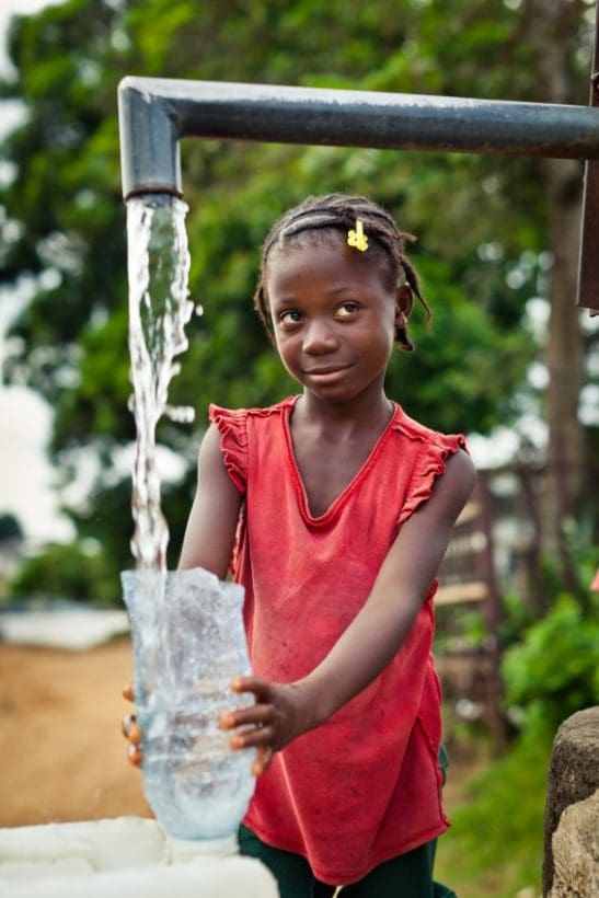 African Girl Water Pump